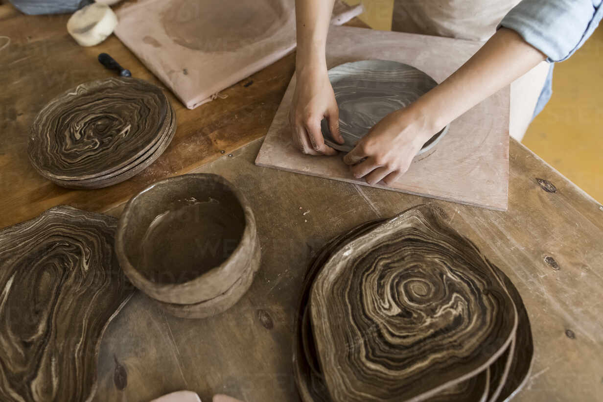 hands of a potter making pottery